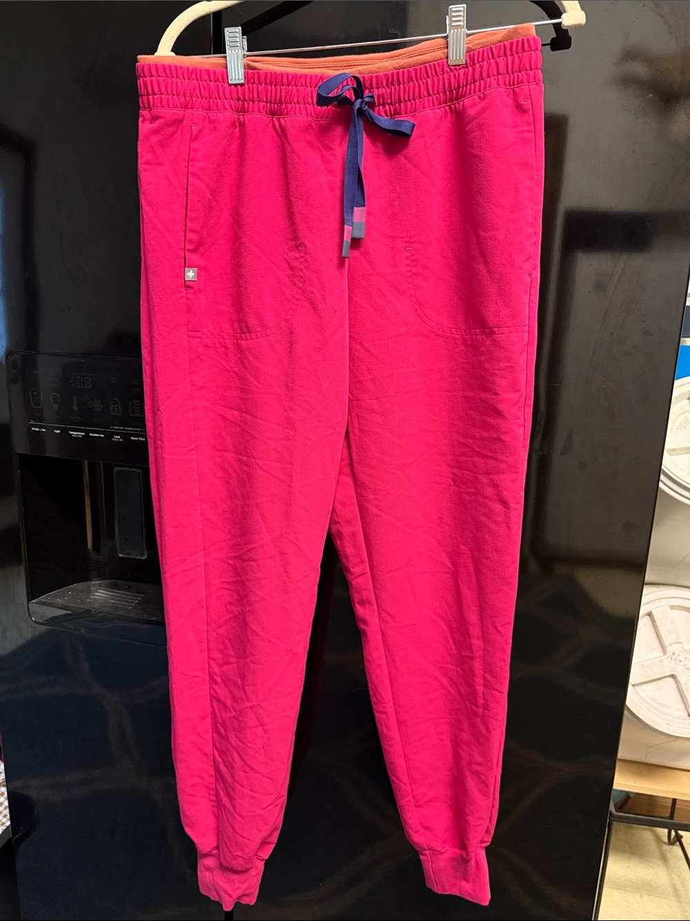 FIGS Women’s Technical Collection Joggers in Hot Pink with Orange Waistband